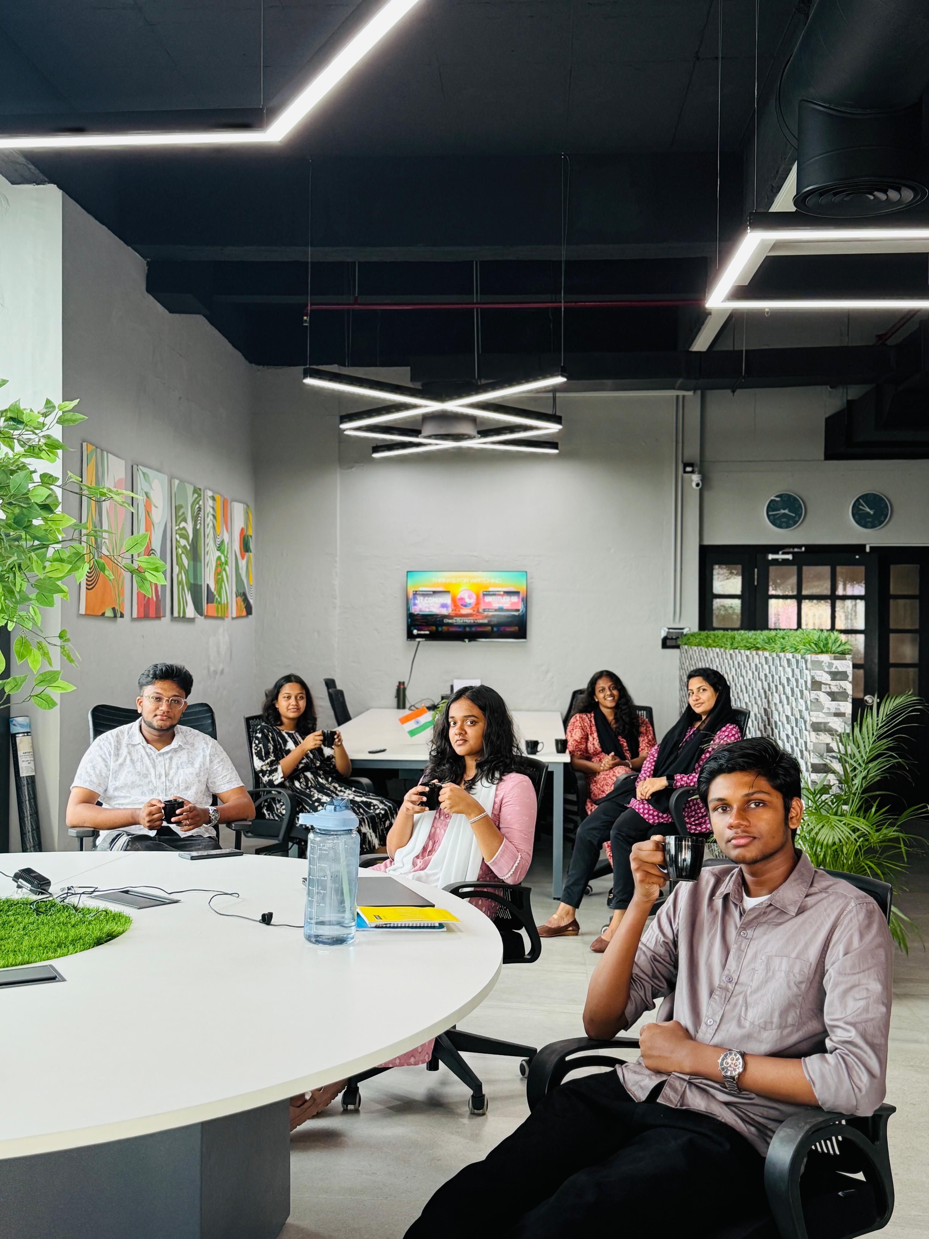 A young professional working with a team in an industry learning environment